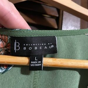 Cute wrap dress. Great trendy green with flowers. Worn once.